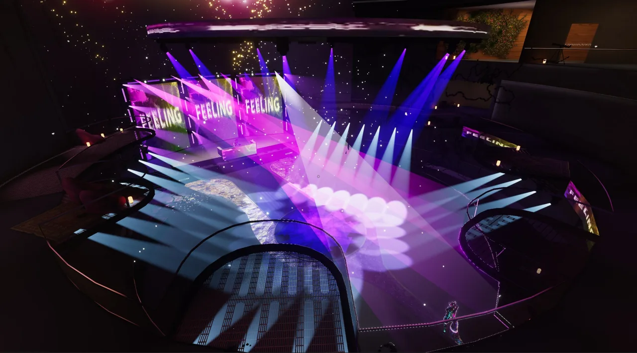 View from a Mainstage balcony across the arena, with pink, blue, and white lights sweeping over the dance floor
