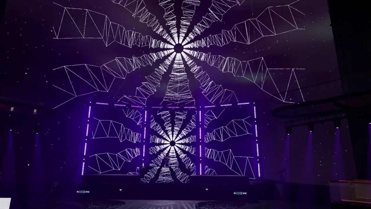 Purple spotlights and geometric screen visuals surrounding the DJ stage at Mainstage
